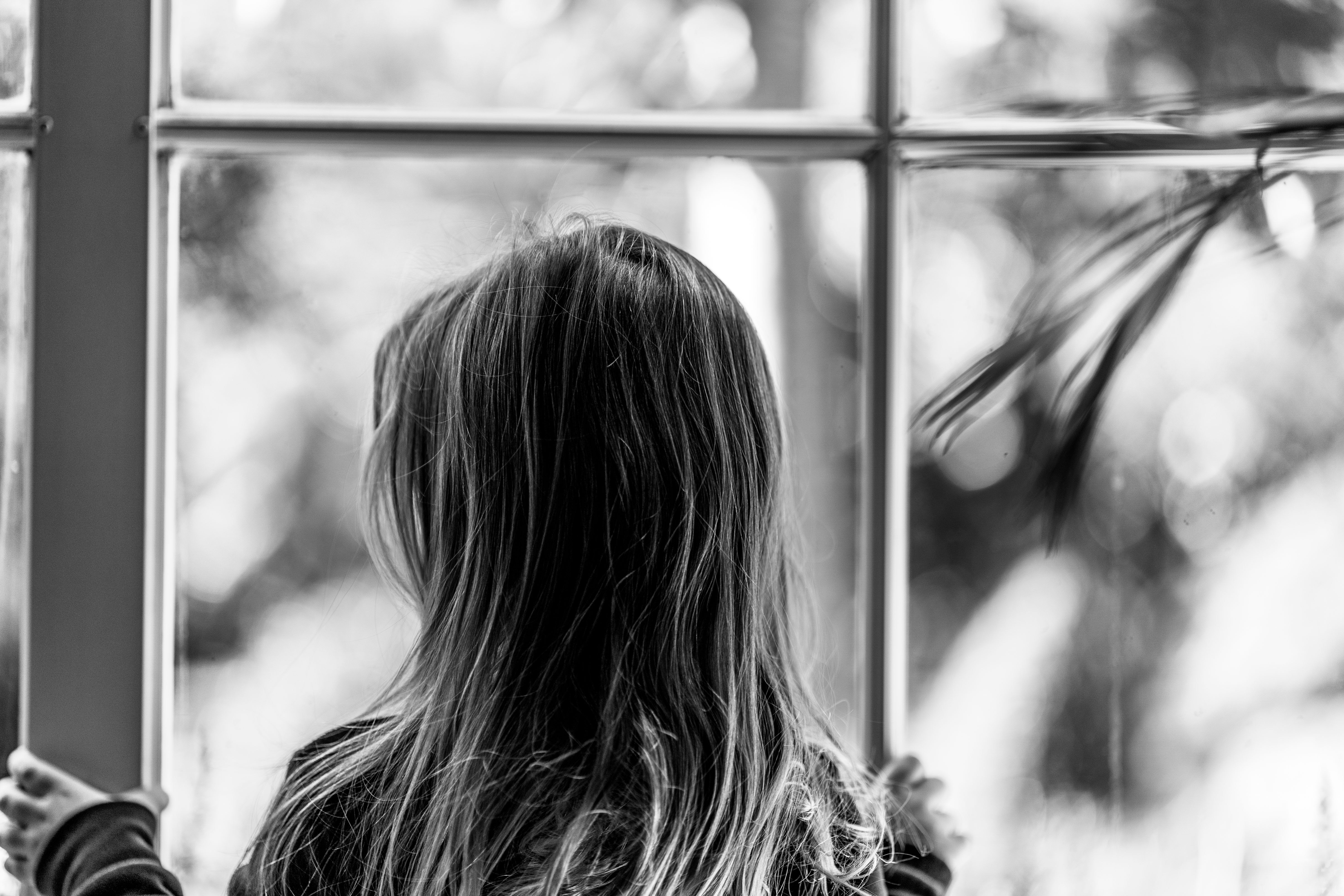 child looking out window